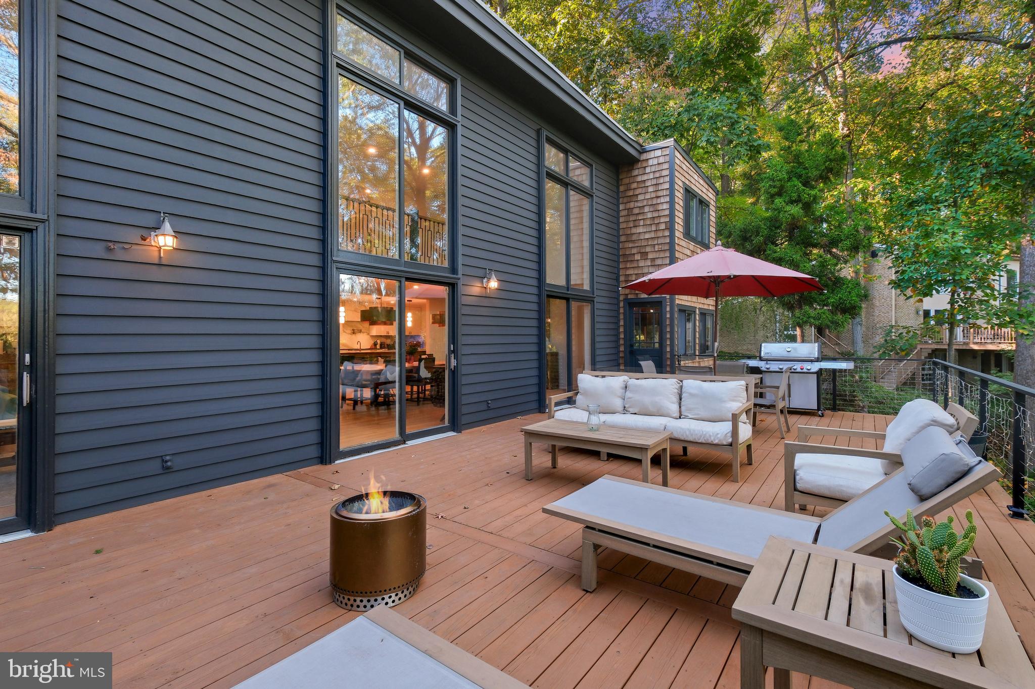 11900 Viewcrest Terrace Silver Spring, MD 20902 - Photo 5 of 69 a view of a patio with couches chairs and a potted plant