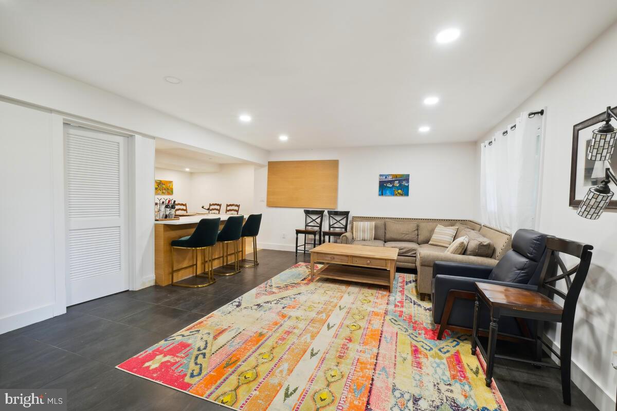 11900 Viewcrest Terrace Silver Spring, MD 20902 - Photo 51 of 69 a living room with furniture and a rug
