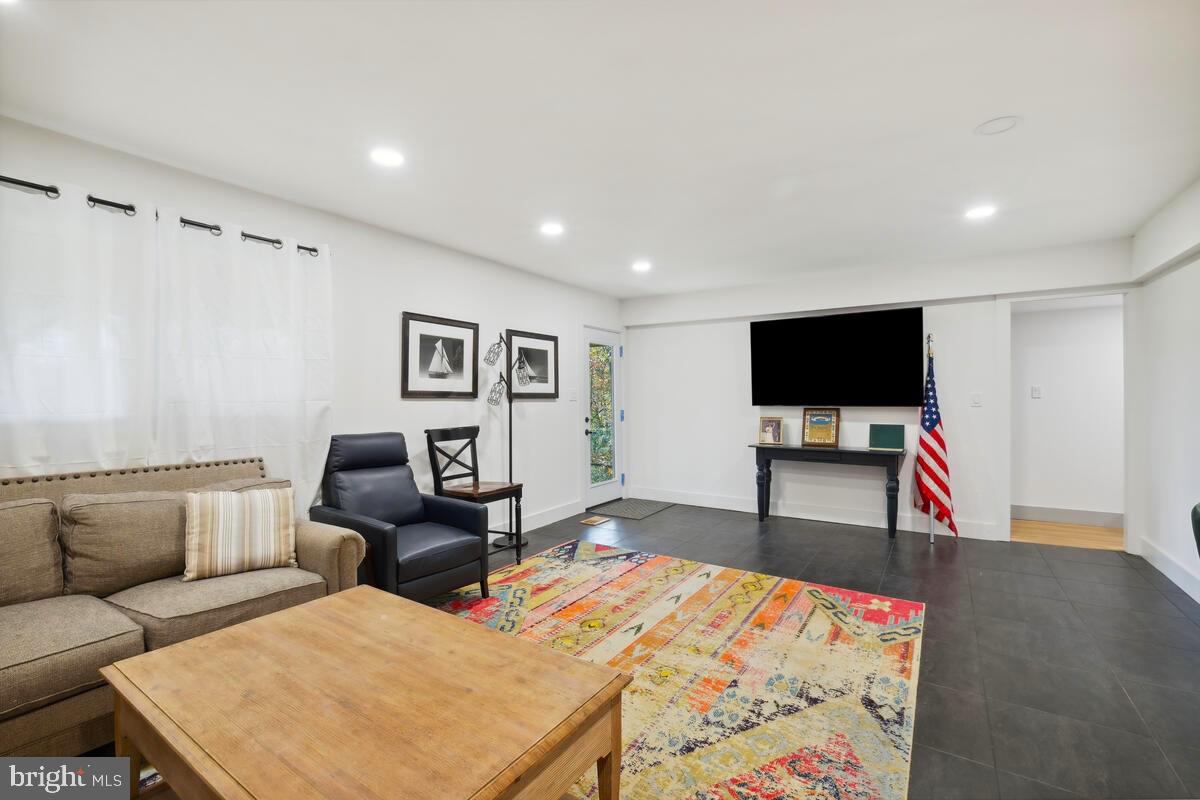 11900 Viewcrest Terrace Silver Spring, MD 20902 - Photo 52 of 69 a living room with furniture and a flat screen tv