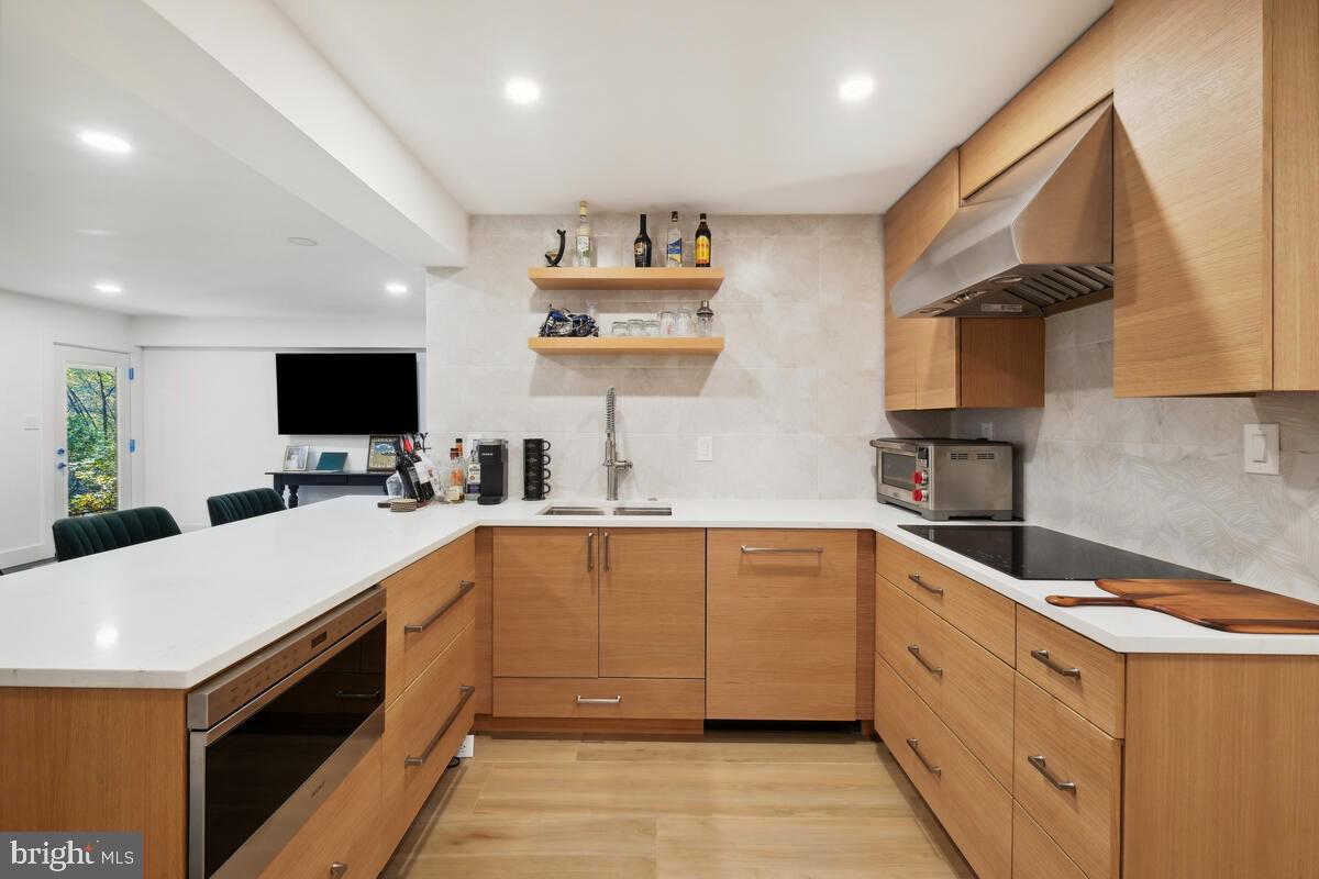 11900 Viewcrest Terrace Silver Spring, MD 20902 - Photo 53 of 69 a kitchen with a sink and white cabinets