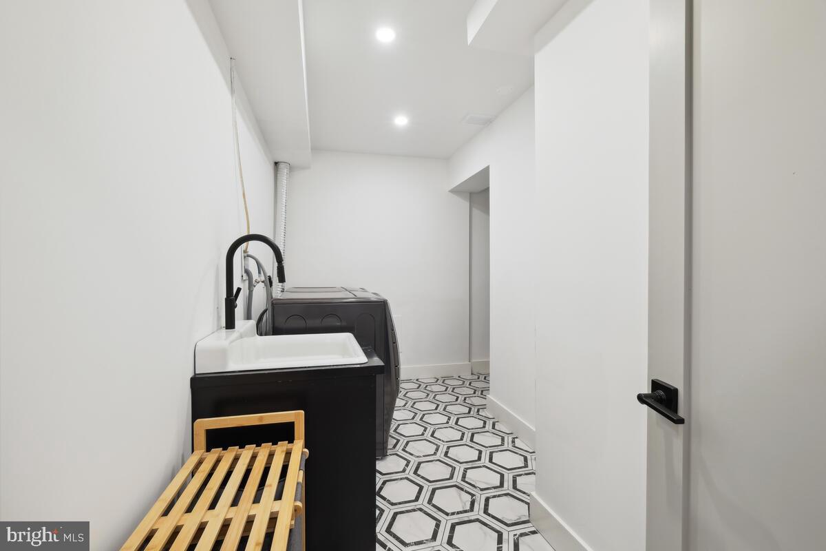 11900 Viewcrest Terrace Silver Spring, MD 20902 - Photo 64 of 69 a bathroom with a sink toilet and shower