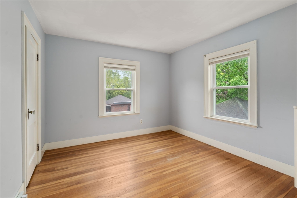 71 Bow Road Belmont, MA 02478 - Photo 18 of 34 a view of an empty room with wooden floor and a window