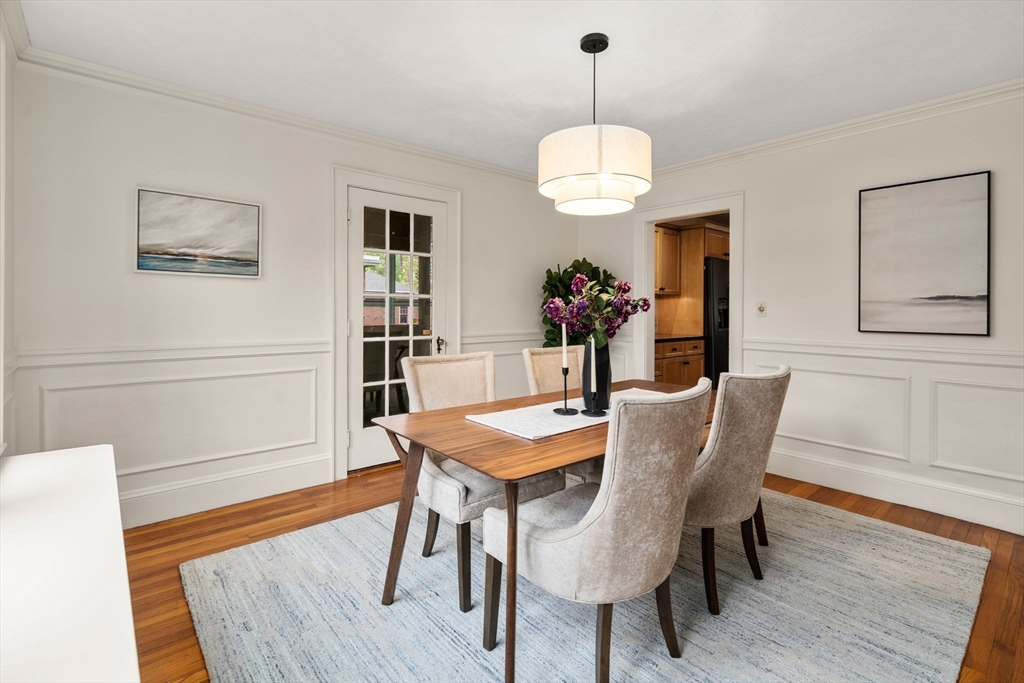 71 Bow Road Belmont, MA 02478 - Photo 9 of 34 a view of a dining room with furniture wooden floor and chandelier