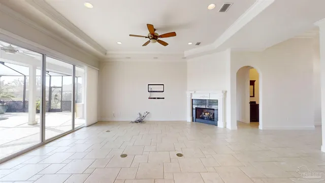 a kitchen with stainless steel appliances kitchen island granite countertop a refrigerator and cabinets