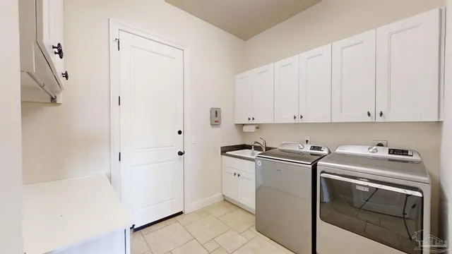 a spacious bathroom with a granite countertop sink mirror and a bathtub