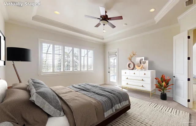 a view of a room with a ceiling fan and window
