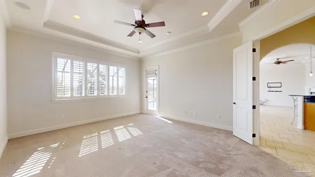 a bathroom with a granite countertop sink a toilet and a mirror