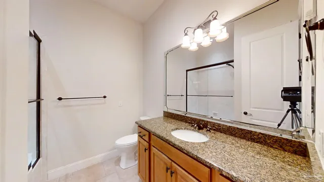 a swimming pool with outdoor seating and yard