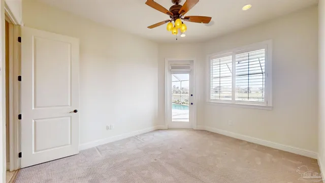 an aerial view of a house with a garden and lake view
