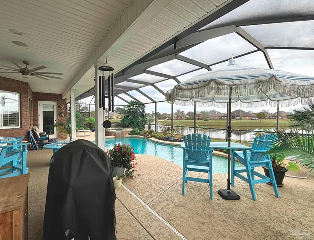 an aerial view of a pool table and mountain view in back