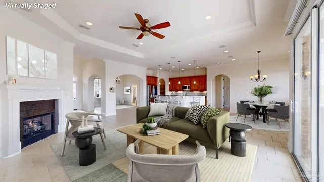 a view of an empty room with a fireplace and a window