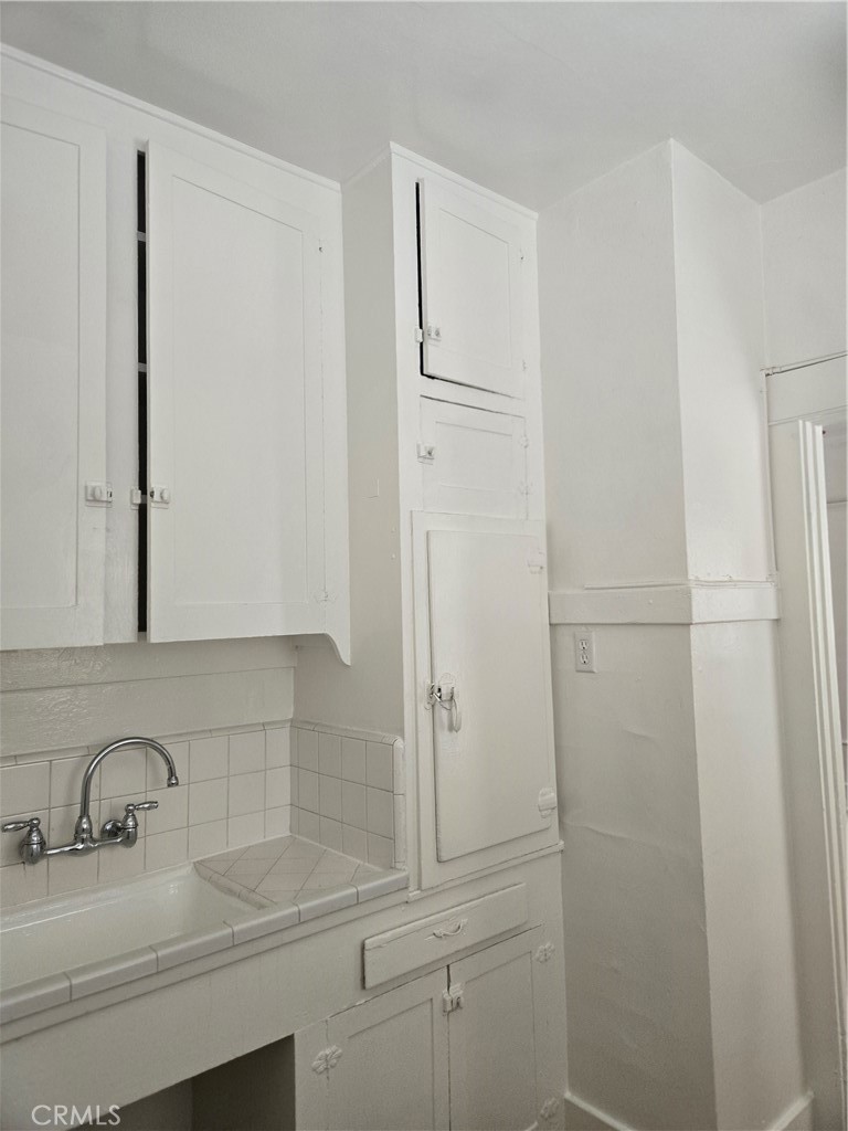 942 2nd Street, Unit 10 Long Beach, CA 90802 - Photo 12 of 28 a bathroom with a sink and a mirror