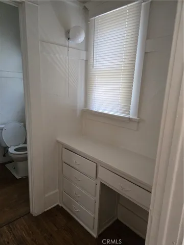 a view of a hallway with washer and dryer