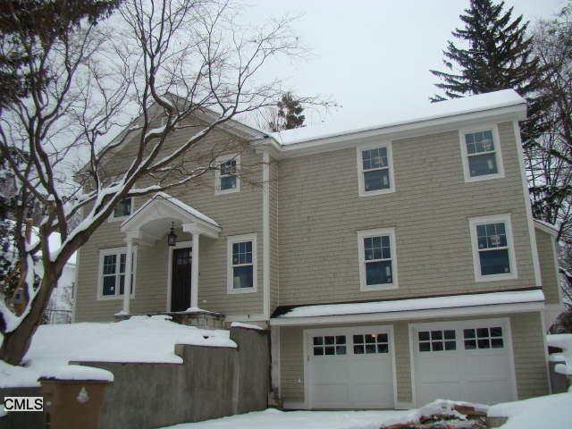 69 Pepper Ridge Road Stamford, CT 06905 - Photo 1 of 1 a front view of a house with a tree
