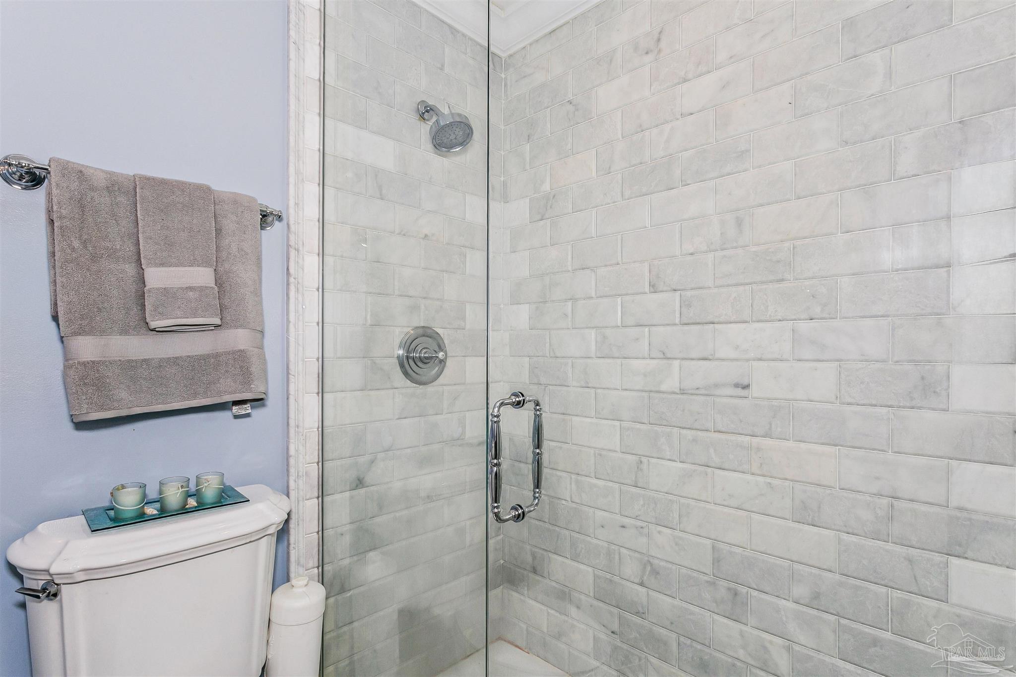 4831 East Olive Road, Unit 2D Pensacola, FL 32514 - Photo 24 of 29 a bathroom with a sink toilet and shower