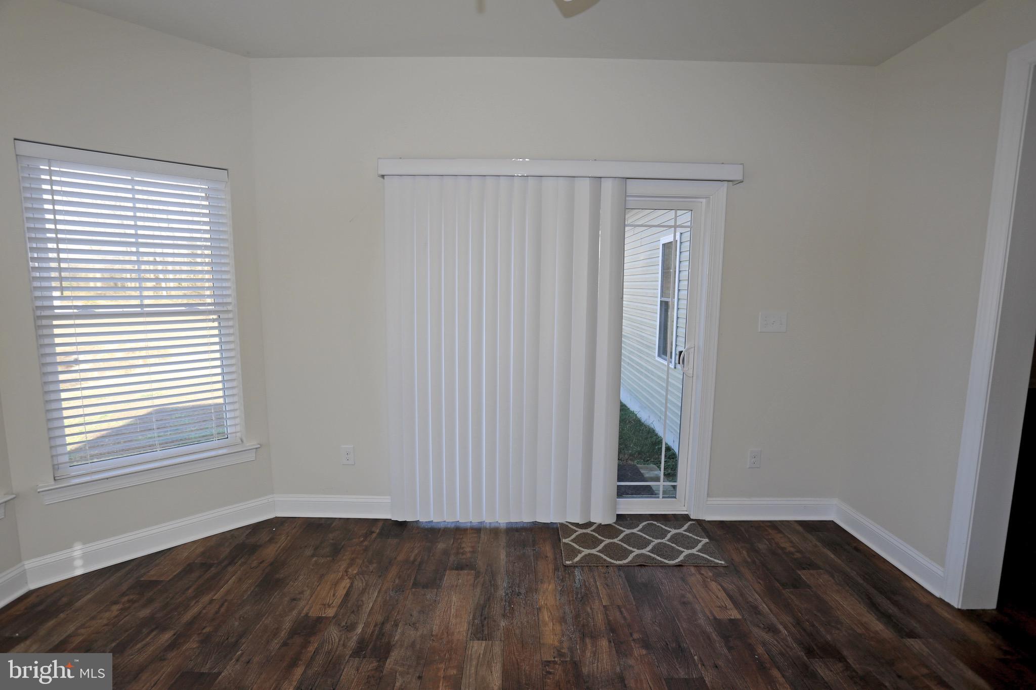 38712 Foxhall Road Frankford, DE 19945 - Photo 59 of 62 Large airy sunroom with access to back yard
