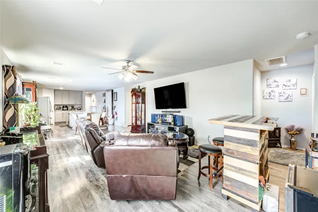 a bathroom with a granite countertop tub sink and mirror