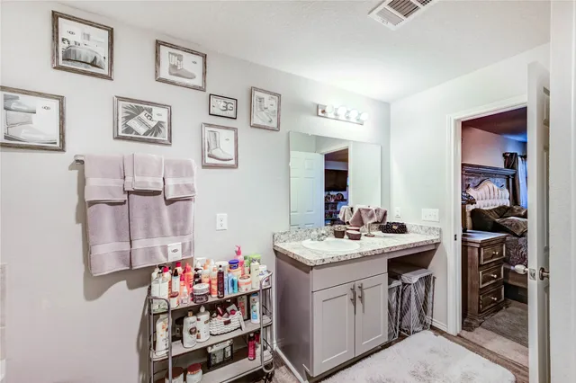 an aerial view of a house with yard and a garden