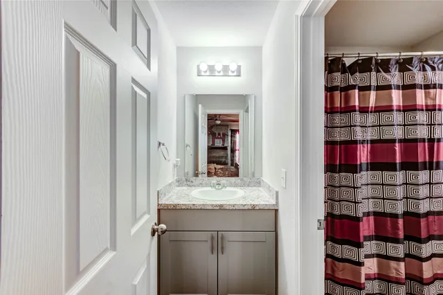 a view of a backyard with plants and a patio