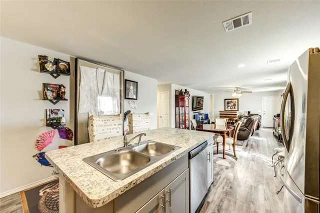a living room with lots of furniture and a large window