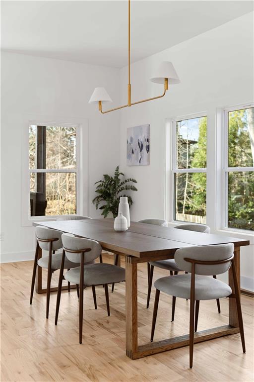286 Sisson Avenue Northeast Atlanta, GA 30317 - Photo 15 of 56 a view of a dining room with furniture window and wooden floor