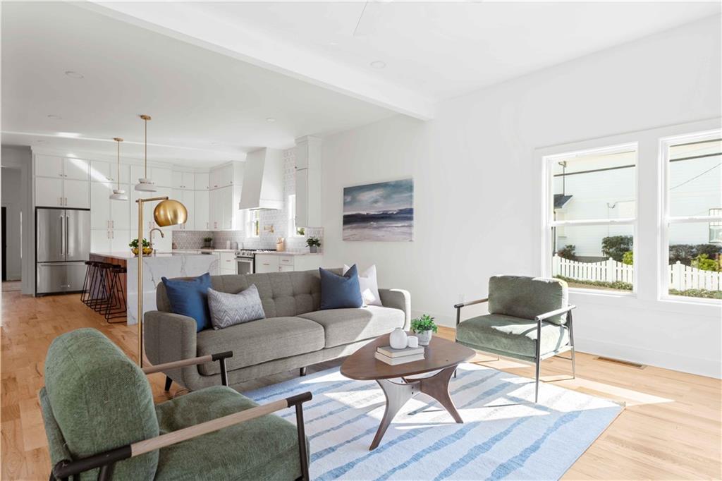 286 Sisson Avenue Northeast Atlanta, GA 30317 - Photo 19 of 56 a living room with furniture kitchen view and a table