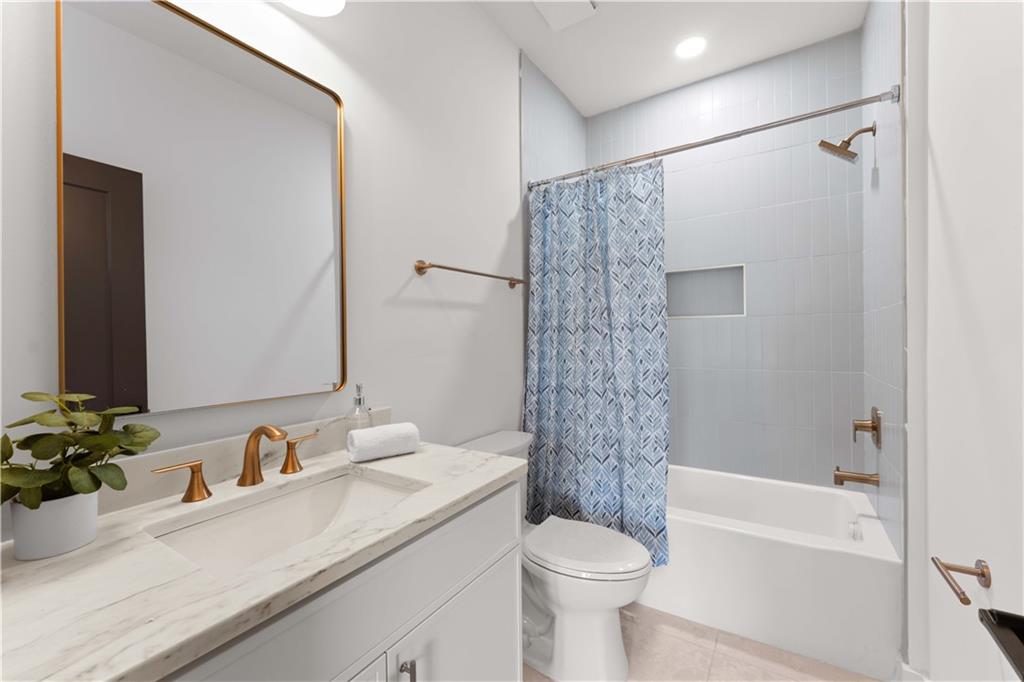 286 Sisson Avenue Northeast Atlanta, GA 30317 - Photo 28 of 56 a bathroom with a sink a toilet and shower