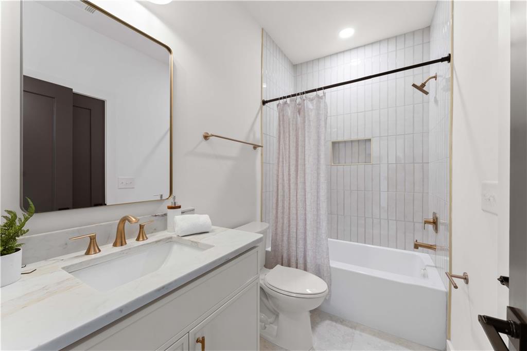 286 Sisson Avenue Northeast Atlanta, GA 30317 - Photo 30 of 56 a bathroom with a sink toilet tub and shower