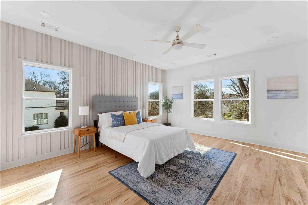 286 Sisson Avenue Northeast Atlanta, GA 30317 - Photo 31 of 56 a living room with a bed furniture and next to a window