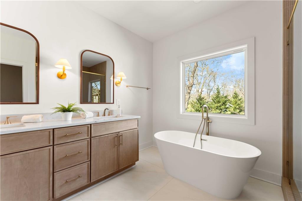 286 Sisson Avenue Northeast Atlanta, GA 30317 - Photo 33 of 56 a bathroom with a bathtub and a sink