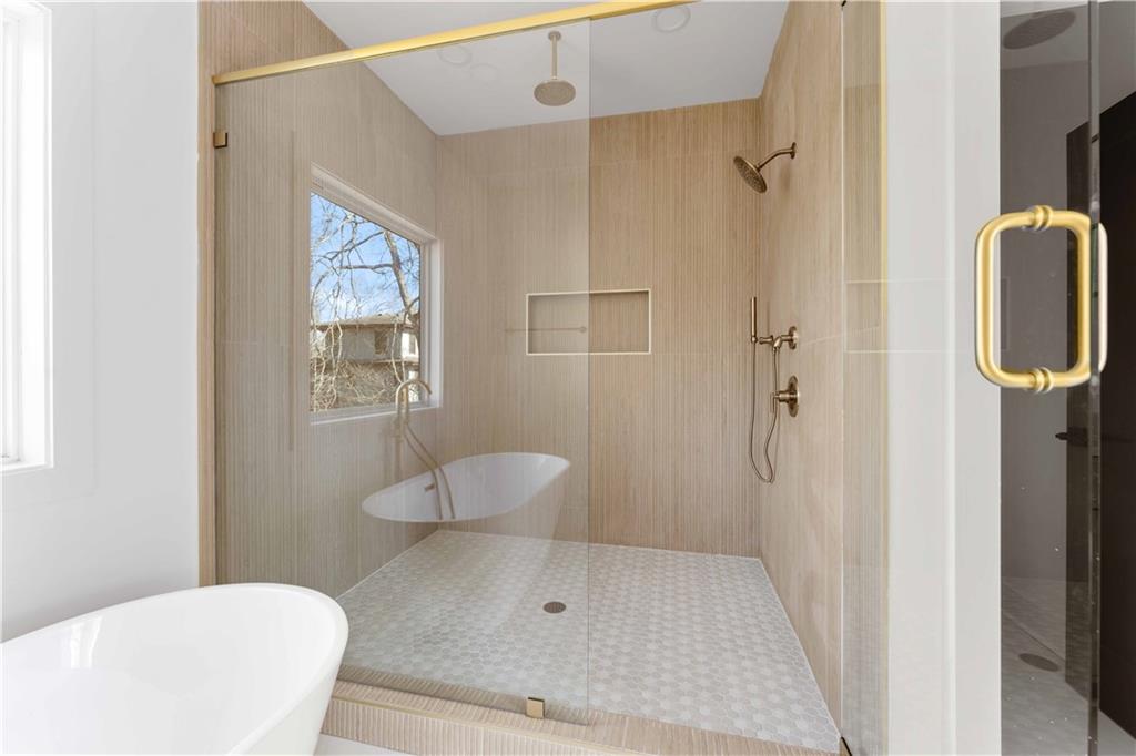 286 Sisson Avenue Northeast Atlanta, GA 30317 - Photo 34 of 56 a bathroom with a toilet and a shower