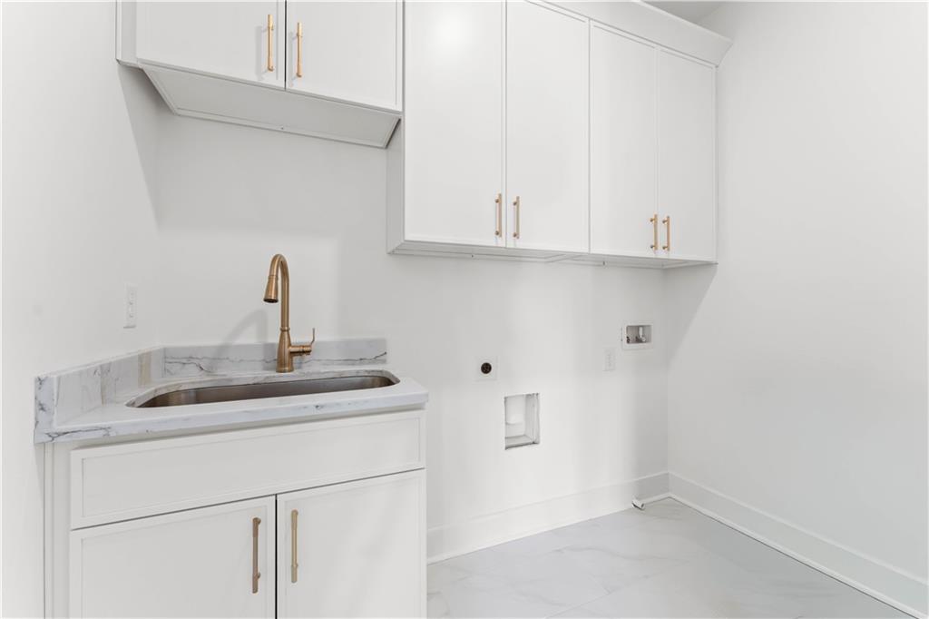 286 Sisson Avenue Northeast Atlanta, GA 30317 - Photo 40 of 56 a kitchen with a sink and cabinets