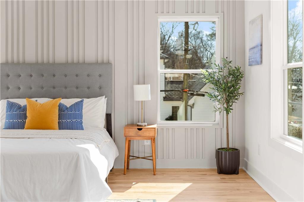 286 Sisson Avenue Northeast Atlanta, GA 30317 - Photo 5 of 56 a bedroom with a bed and a window