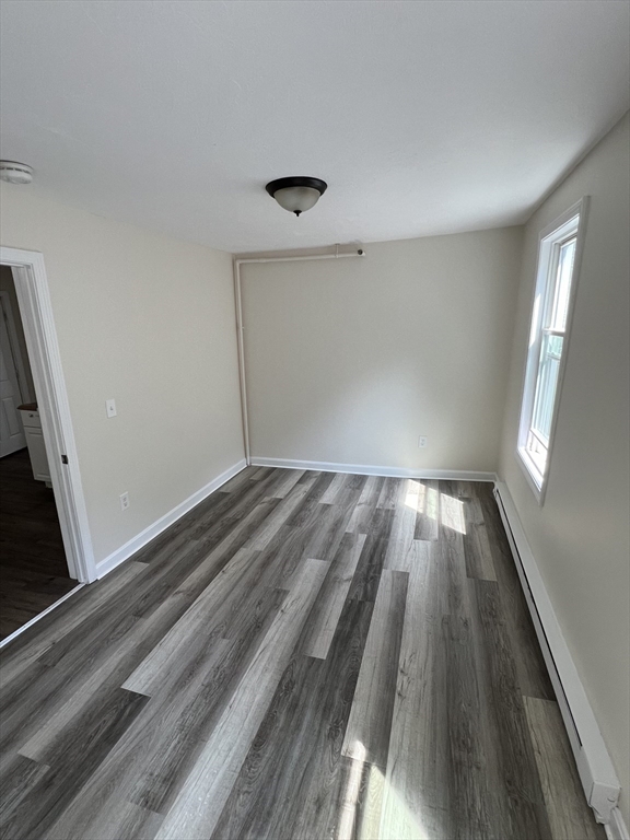 12 Aspen Street Ware, MA 01082 - Photo 8 of 17 wooden floor in an empty room