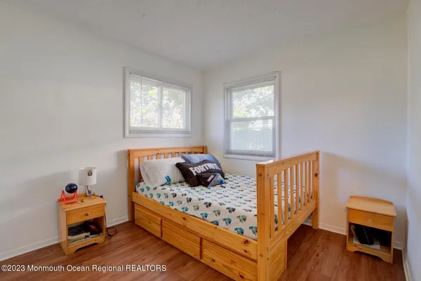 a bed room with a bed and a window