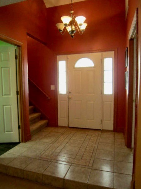 1450 Johnson Road Macon, GA 31220 - Photo 2 of 23 a view of a livingroom with a chandelier fan and windows