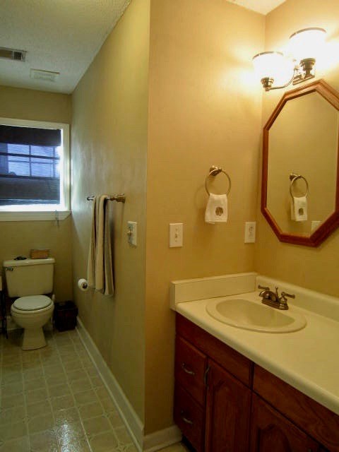 1450 Johnson Road Macon, GA 31220 - Photo 16 of 23 a bathroom with a sink and mirror