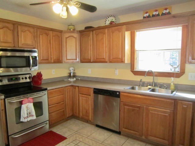 1450 Johnson Road Macon, GA 31220 - Photo 7 of 23 a kitchen with a sink stove and microwave