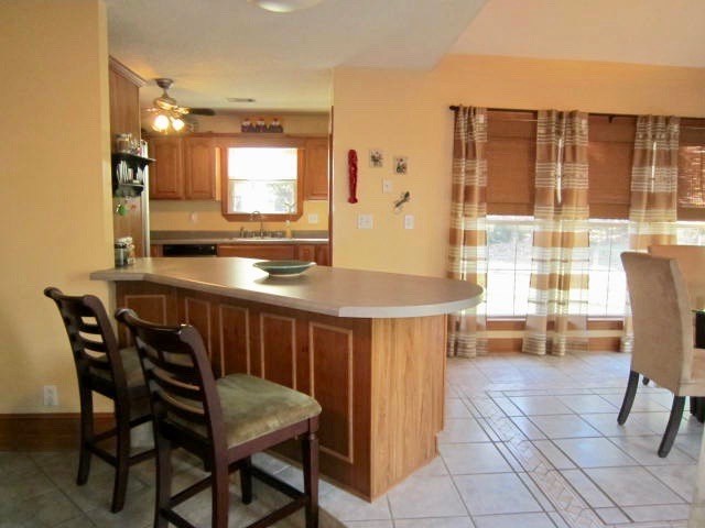 1450 Johnson Road Macon, GA 31220 - Photo 9 of 23 a kitchen with a table chairs and a counter top space