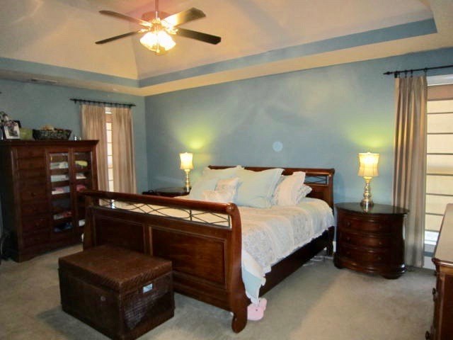 1450 Johnson Road Macon, GA 31220 - Photo 10 of 23 a bedroom with a bed and a chandelier