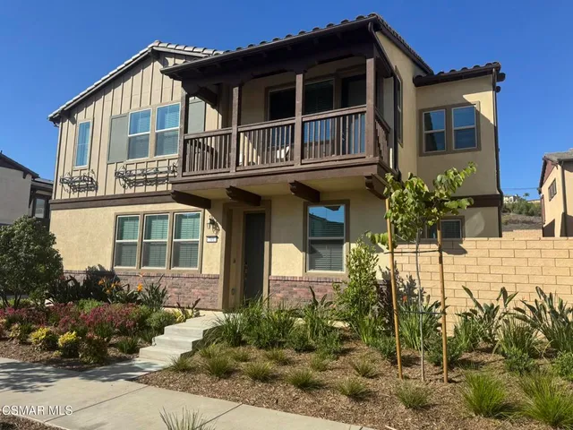 a house view with a outdoor space
