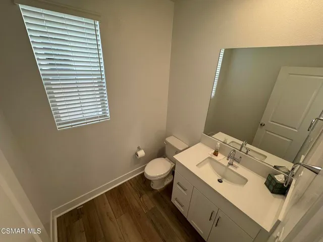 a bathroom with a sink and toilet