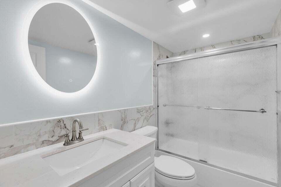 300 Duck Key Drive, Unit 9 Duck Key, FL 33050 - Photo 11 of 22 a bathroom with a sink toilet and shower