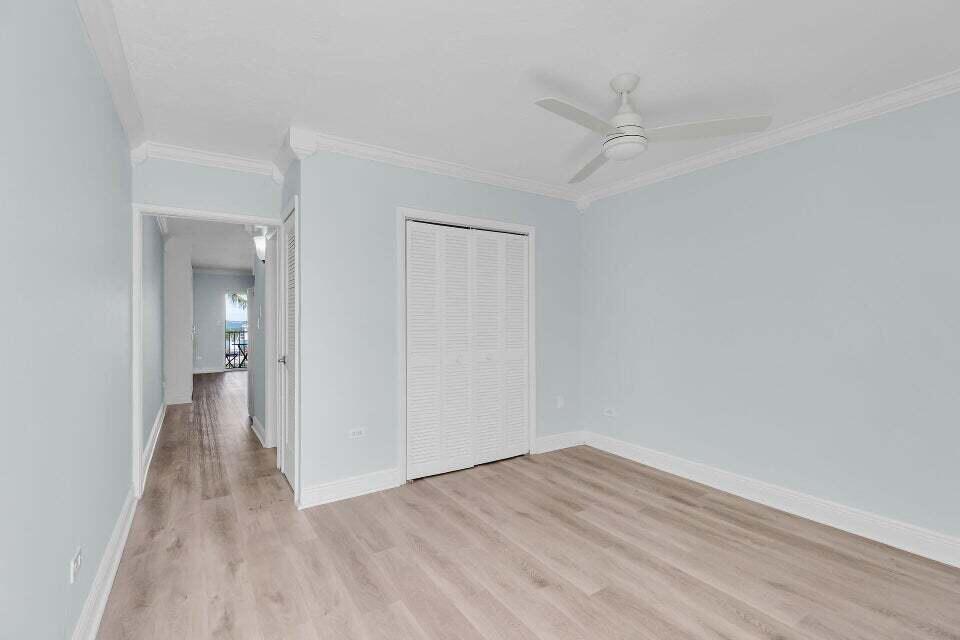 300 Duck Key Drive, Unit 9 Duck Key, FL 33050 - Photo 12 of 22 a view of a room with wooden floor and a ceiling fan