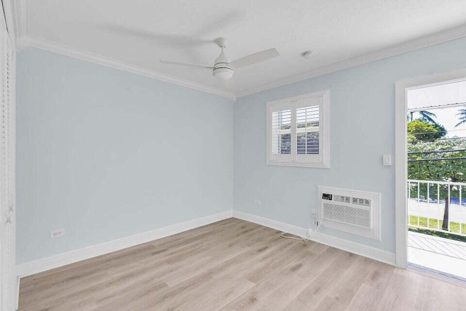 300 Duck Key Drive, Unit 9 Duck Key, FL 33050 - Photo 14 of 22 an empty room with wooden floor and windows