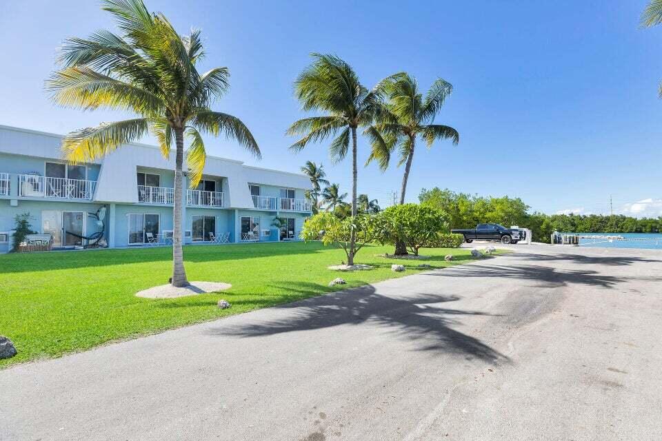 300 Duck Key Drive, Unit 9 Duck Key, FL 33050 - Photo 19 of 22 a front view of house with yard and green space