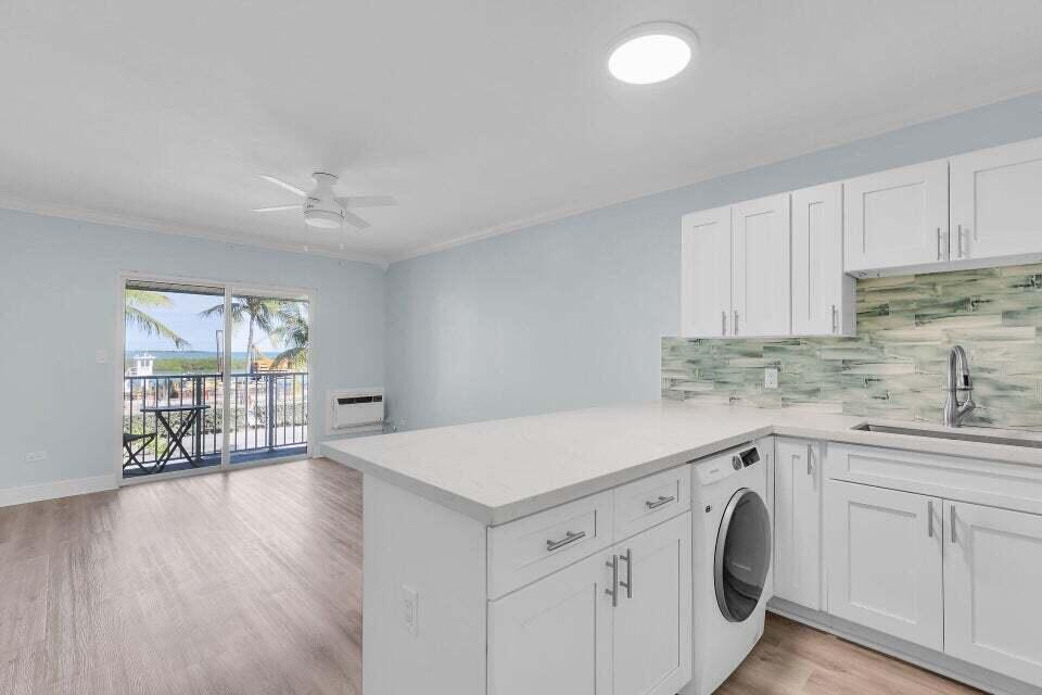 300 Duck Key Drive, Unit 9 Duck Key, FL 33050 - Photo 6 of 22 a view of a kitchen with wooden floor and electronic appliances