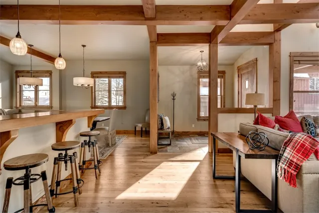 an outdoor space with lots of furniture and a chandelier