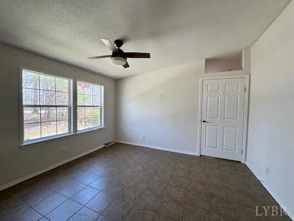 a house that has a tree in front of it