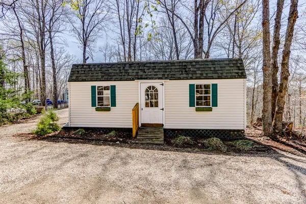 a backyard of a house with lots of green space